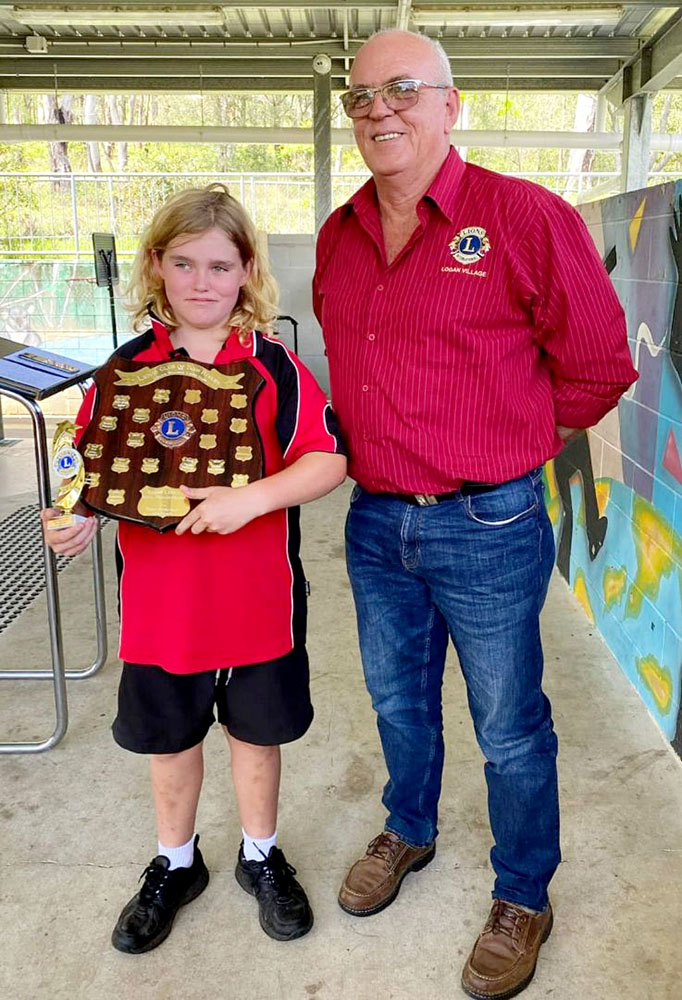 Lion Euan presents Logan Village Lions Most Improved Award